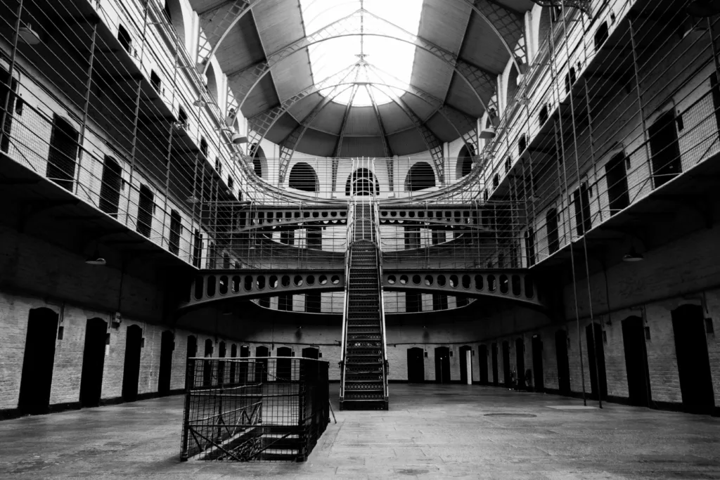 Kilmainham Gaol (Image Source: Photo by <a href="https://unsplash.com/@yoavaziz?utm_content=creditCopyText&utm_medium=referral&utm_source=unsplash">Yoav Aziz</a> on <a href="https://unsplash.com/photos/grayscale-photo-of-building-fu1T1glXxGM?utm_content=creditCopyText&utm_medium=referral&utm_source=unsplash">Unsplash</a>)